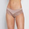 Model wears Lace Trim Brazilian in MOCHA. On body front view