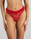 Model wears Tinsel Tease High Cut Brief in SALSA. On body front view