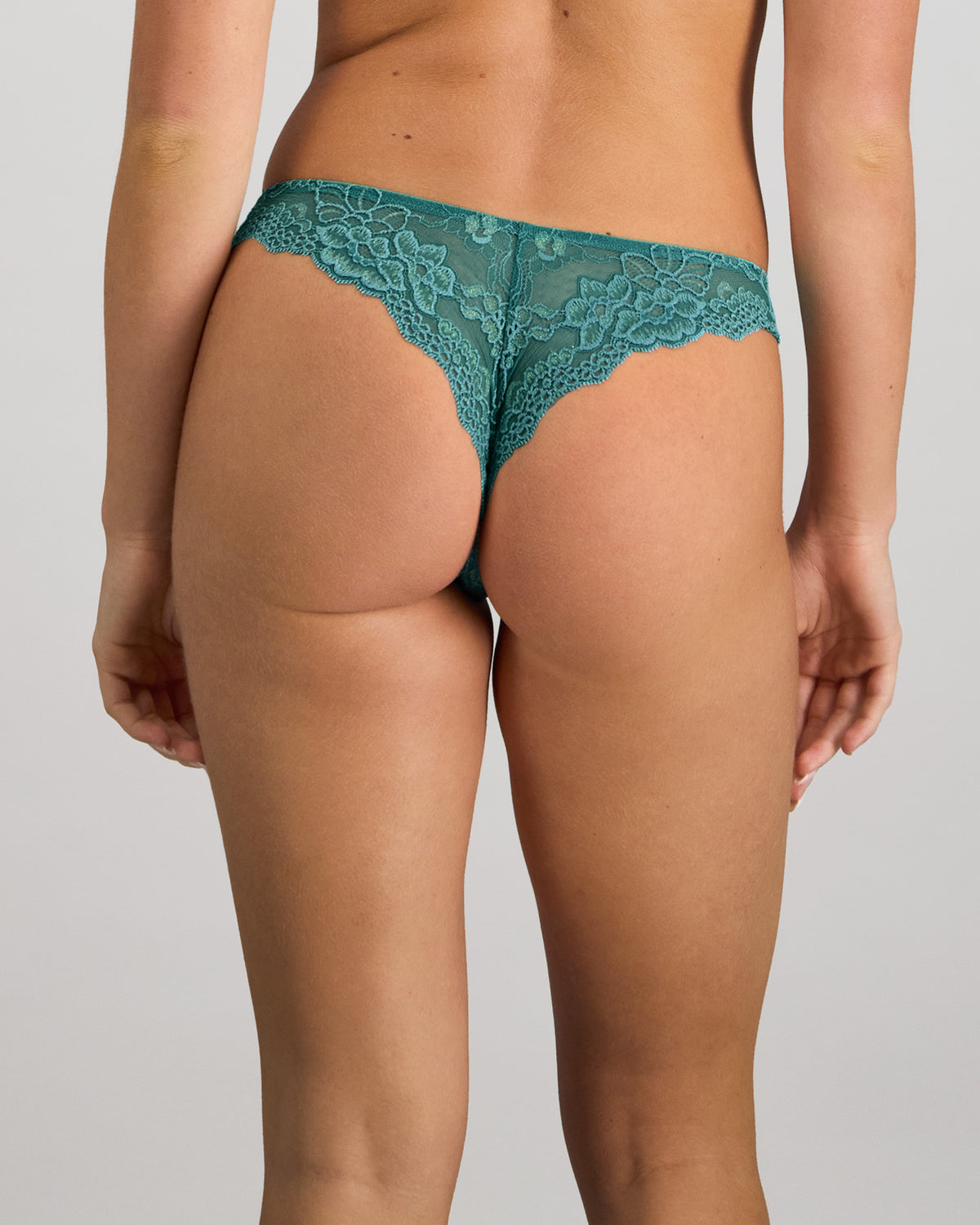 Model wears My Fit Lace Thong in MEDITERRANEA. On body back view