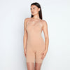 Model wears Medium Control Jumpsuit in CARAMEL. On body front view