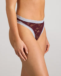Model wears Leo Thong in FIG/SKYWAY. On body side view