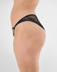 Model wears Niara Bikini in BLACK. On body side view