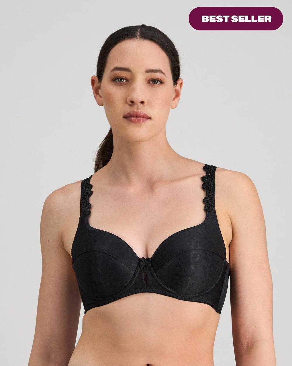 Model wears Damask Contour Bra in BLACK. On body front view