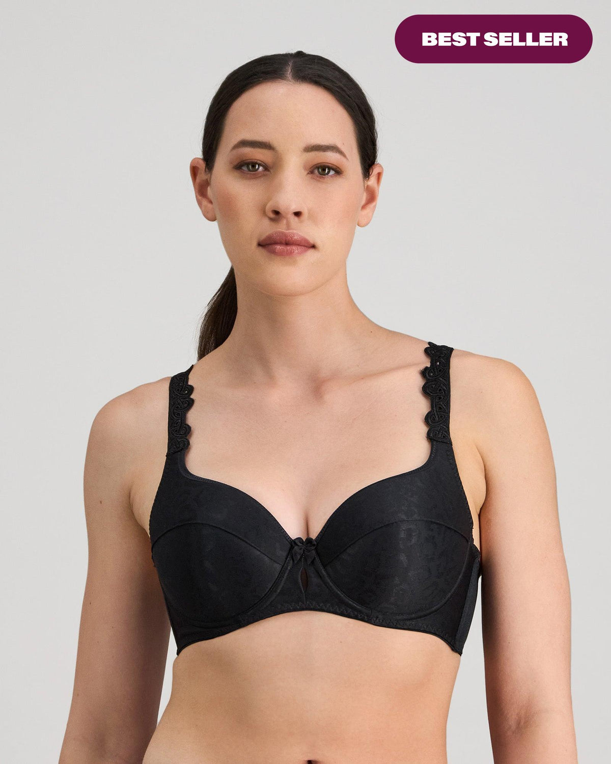 Model wears Damask Contour Bra in BLACK. On body front view