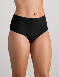 Model wears Extra-Ordinary Full Brief in BLACK. On body side view