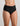 Model wears Extra-Ordinary Full Brief in BLACK. On body side view