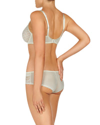 Model wears Ece Queen Underwire Bra in GARDENIA/SOFT PINK. On body back view