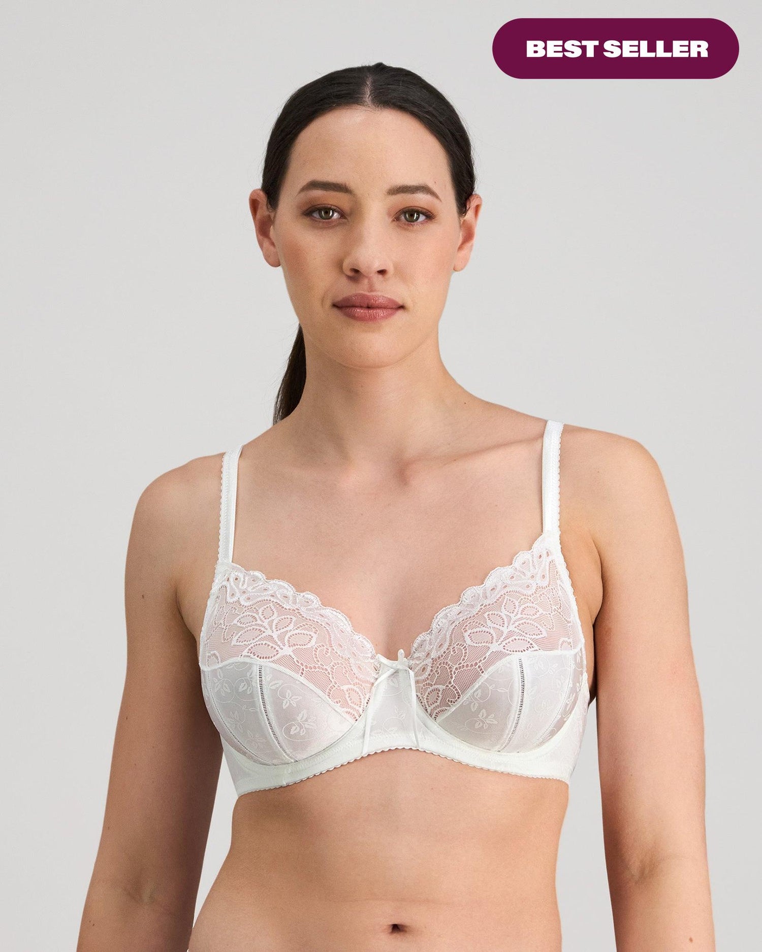 Model wears Yvette Underwire Bra in WHITE. On body front view