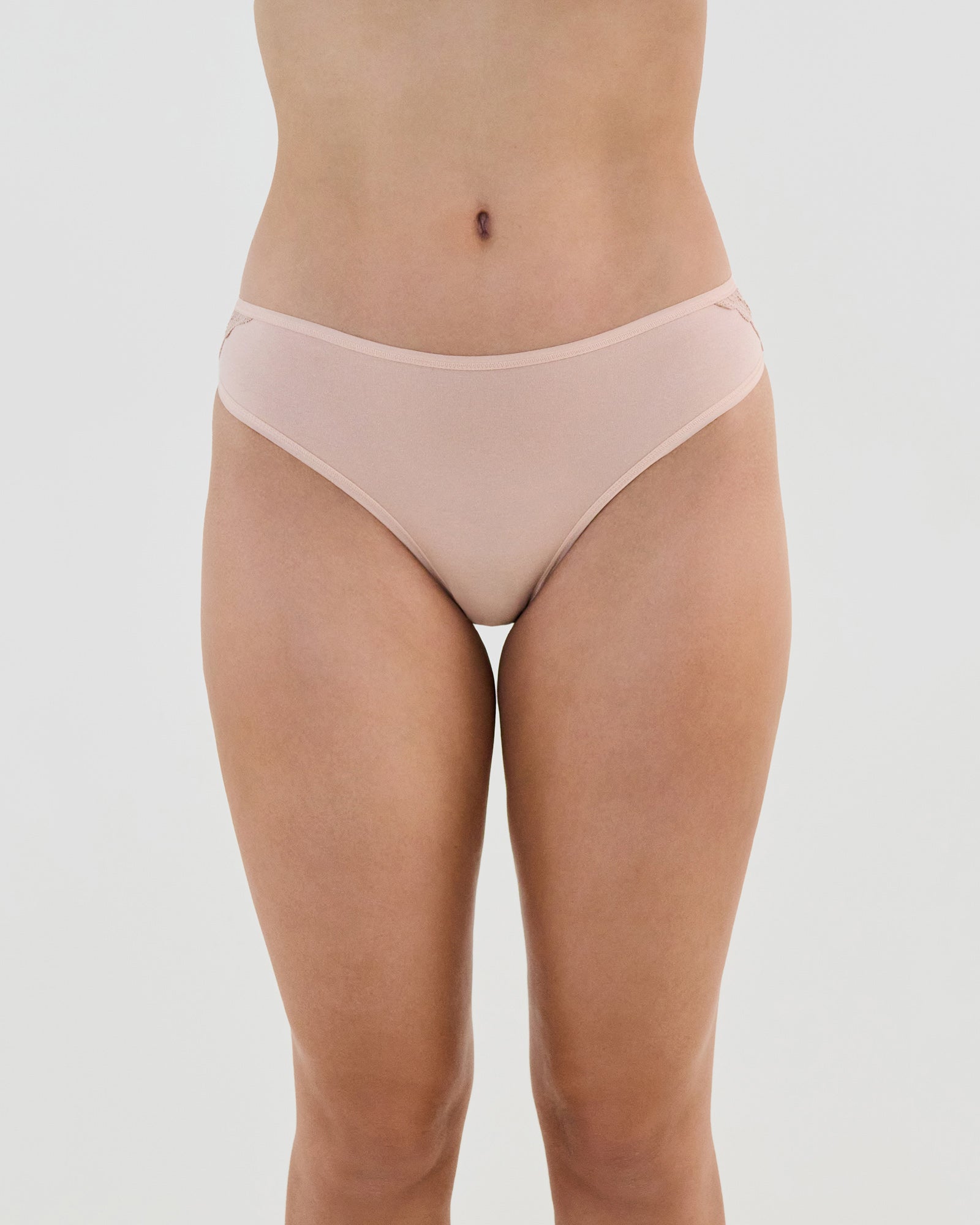 Model wears Cotton And Lace Bikini in LATTE. On body front view