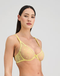 Model wears Sunlit Underwire Bra in LEMON MERINGUE. On body side view