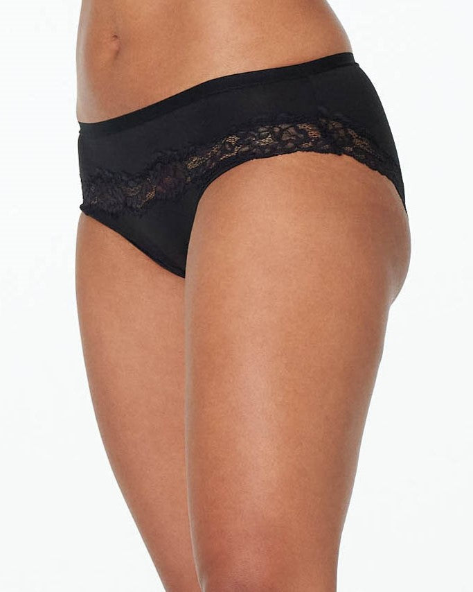 Model wears Simply Me Bikini in BLACK. On body side view