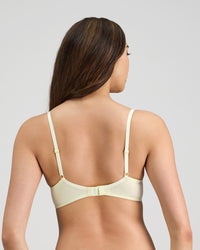 Model wears Embrace Contour Bra in TRANSPARENT YELLOW. On body back view