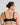 Model wears Delicate Lace Underwire Bra in BLACK/CREAM TAN. On body back view