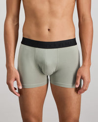 Model wears Everyday Essential Mens Trunk in ICEBERG GREEN. On body front view
