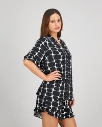 Model wears Audacious Dreams Short PJ in MINIMALIST PRINT. On body side view