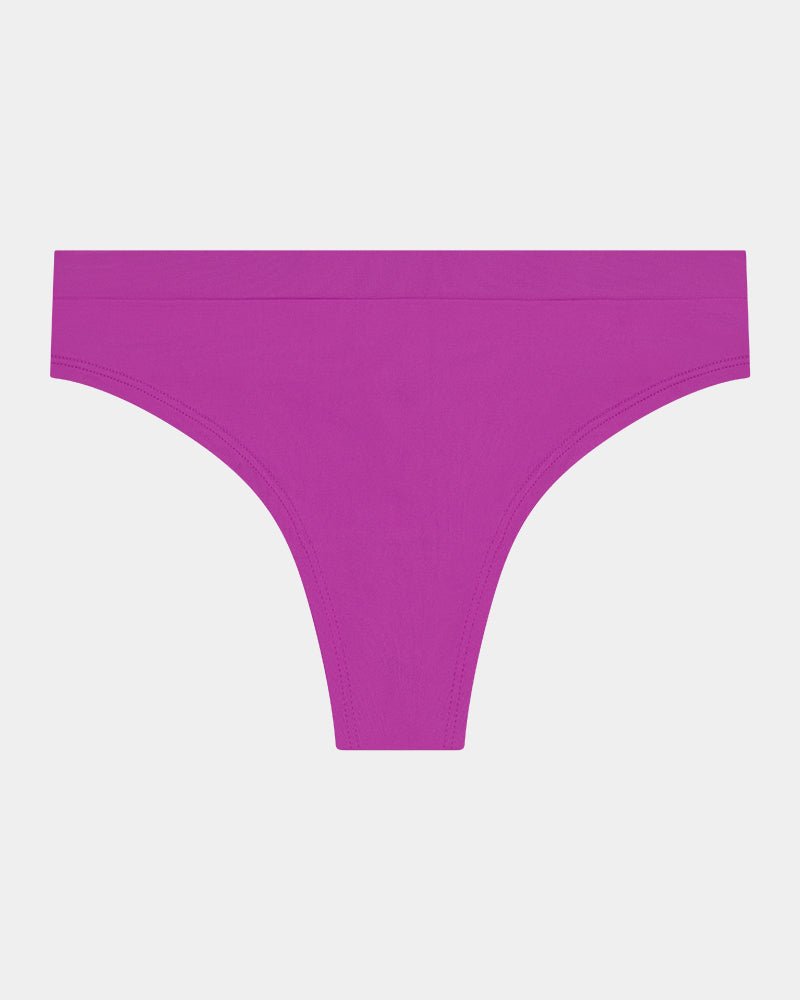 Seamless Soft Thong in RADIANT ORCHID. Flat lay front view