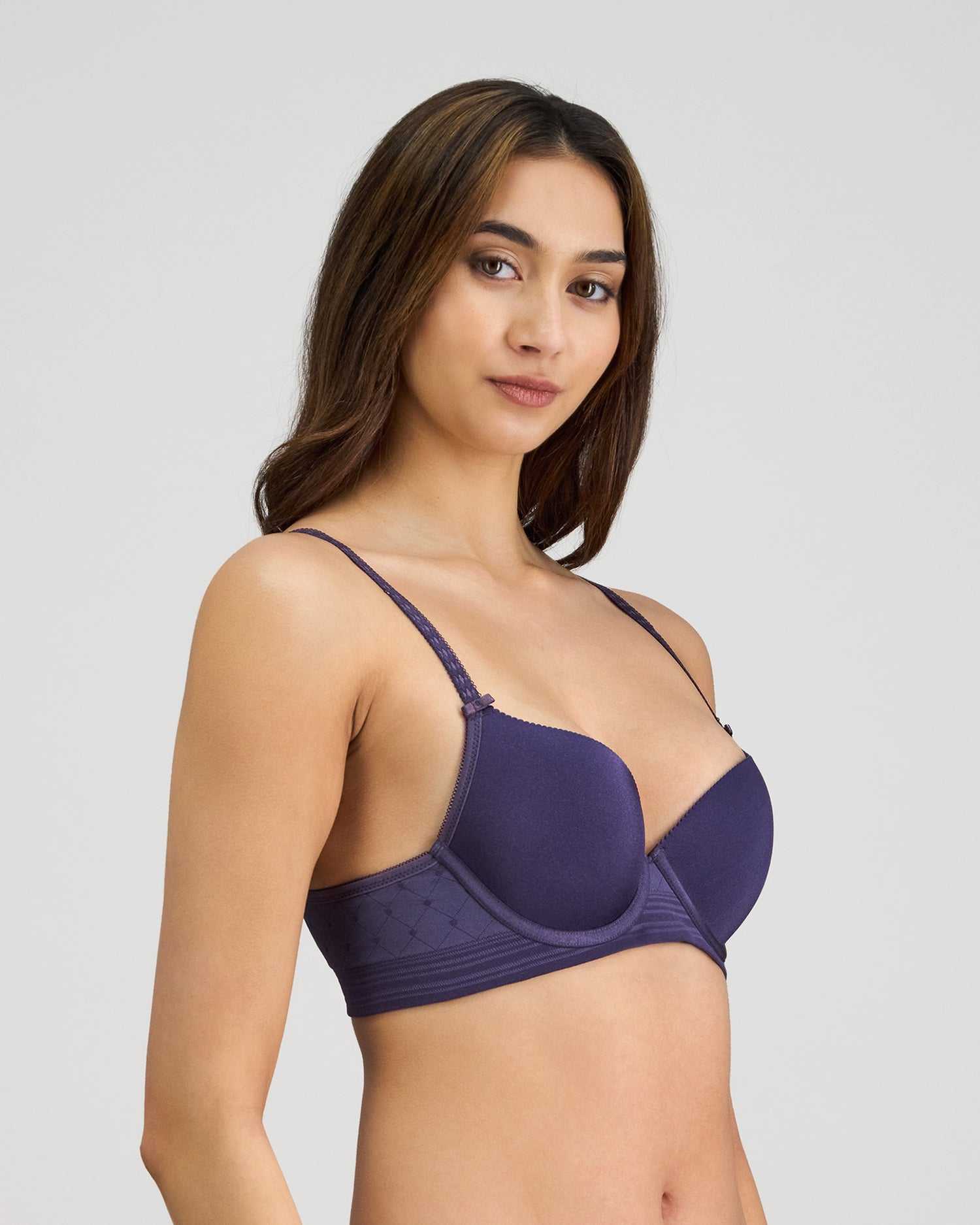Model wears Bendon Body Contour Bra in PURPLE VELVET. On body side view