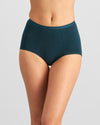 Model wears Body Cotton Full Brief in PONDEROSA PINE. On body front view