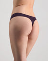 Model wears Au Naturel Thong in PLUM PERFECT. On body side view