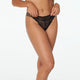 Model wears Fae Thong in BLACK. On body front view