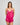 Model wears Eva Jean Short in FANTASY FUCHSIA. On body front view
