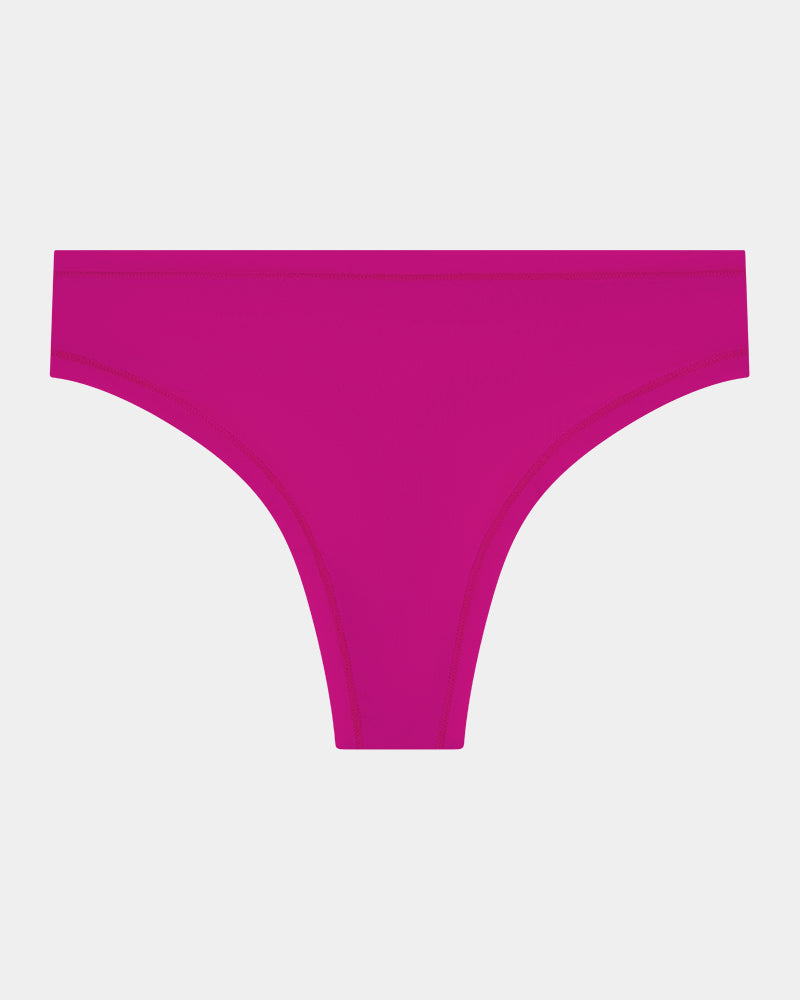 Extra-Ordinary Thong in FANTASY FUCHSIA. Flat lay front view