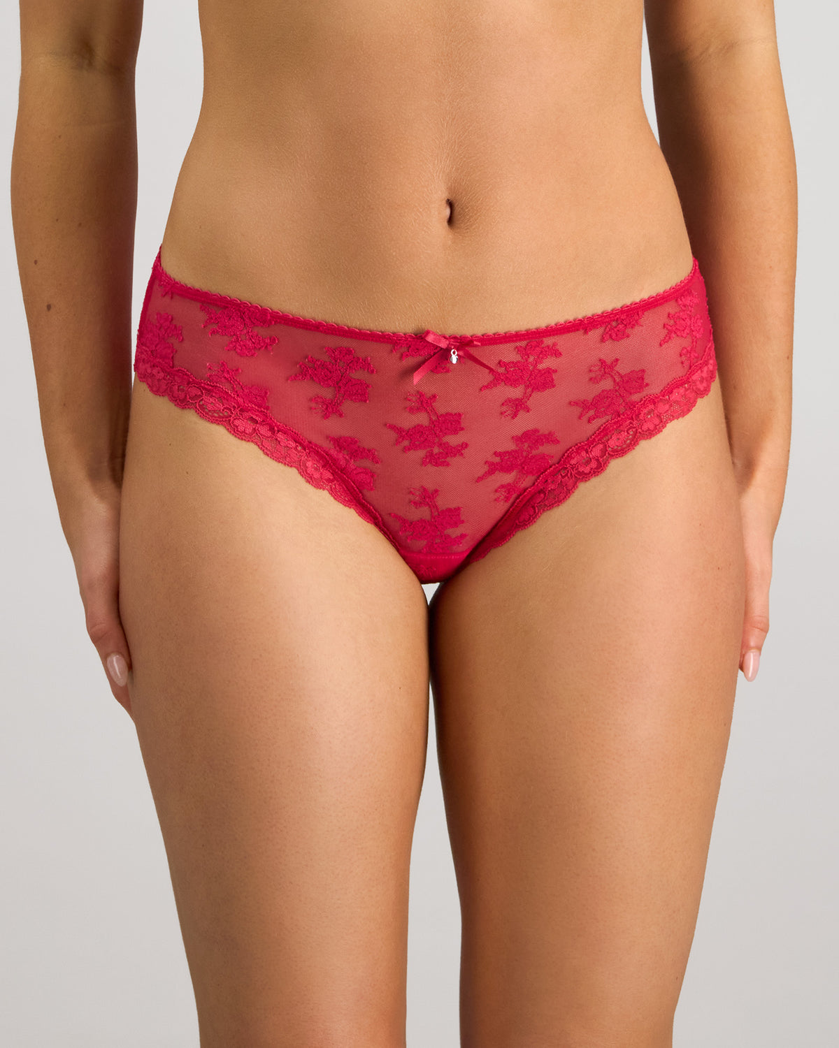 Model wears Light Lace Bikini in JAZZY. On body front view
