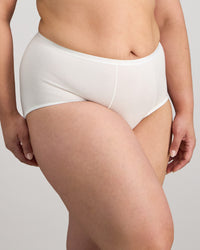 Model wears Body Cotton Full Brief in WHITE. On body side view