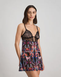 Model wears Adaline Chemise in BLACK FLORAL PRINT. On body side view
