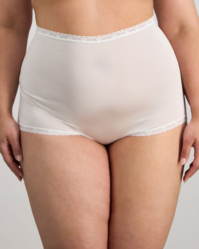 Model wears Nylon Tricot Full Brief in WHITE. On body front view