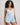 Model wears Sweet Indulgence Cami & Short Set in SKYWAY/WHITE. On body side view
