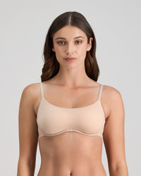 Model wears Extra-Ordinary Contour Bra in LATTE. On body front view