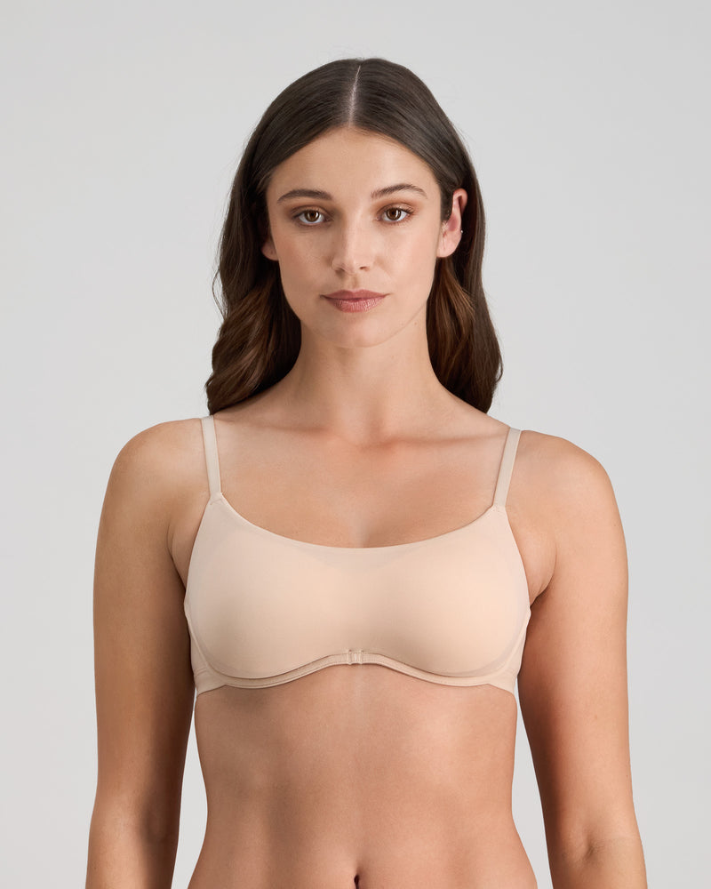 Model wears Extra-Ordinary Contour Bra in LATTE. On body front view