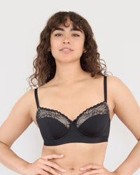 Model wears Castaway Contour Long Line Bra in BLACK. On body front view