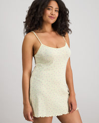 Model wears Smoothie Chemise in TRANSPARENT YELLOW. On body side view
