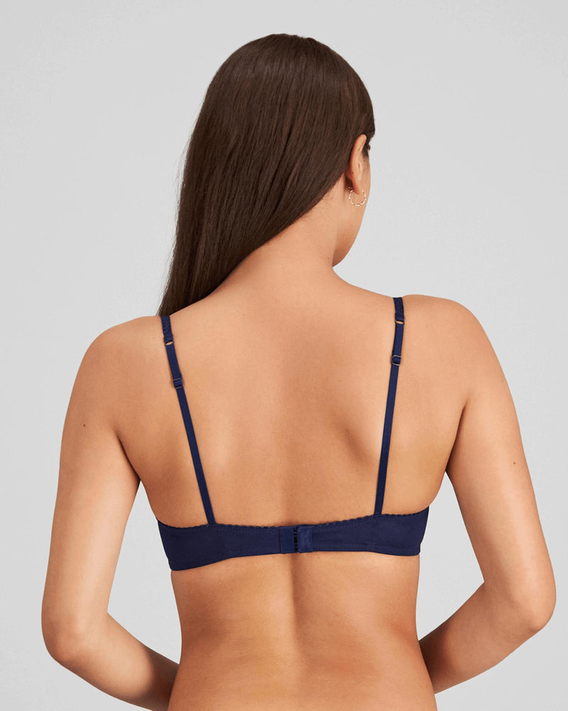 Model wears Sofia Underwire Bra in Medieval Blue. On body back view