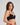 Model wears Play Contour Long Line Bra in BLACK. On body side view