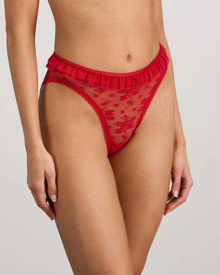 Model wears Tinsel Tease High Cut Brief in SALSA. On body side view