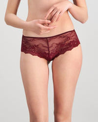 Model wears My Fit Lace Brazilian in WINDSOR WINE. On body front view