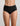 Model wears Extra-Ordinary Full Brief in BLACK. On body front view