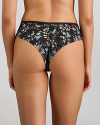 Model wears Lost Paradise Brazilian in BLACK PRINT. On body back view