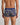Model wears Retros Print Mens Trunk in GOLD TROPICAL PRINT. On body back view
