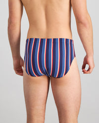 Model wears Cotton Stretch Mens Brief in BITTERSWEET/REGATTA STRIPE. On body back view