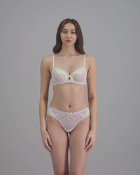 model-poses-in-light-pink-and-yellow-bra-and-underwear