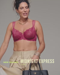 model-poses-wearing-red-bra-and-blazer-and-suit