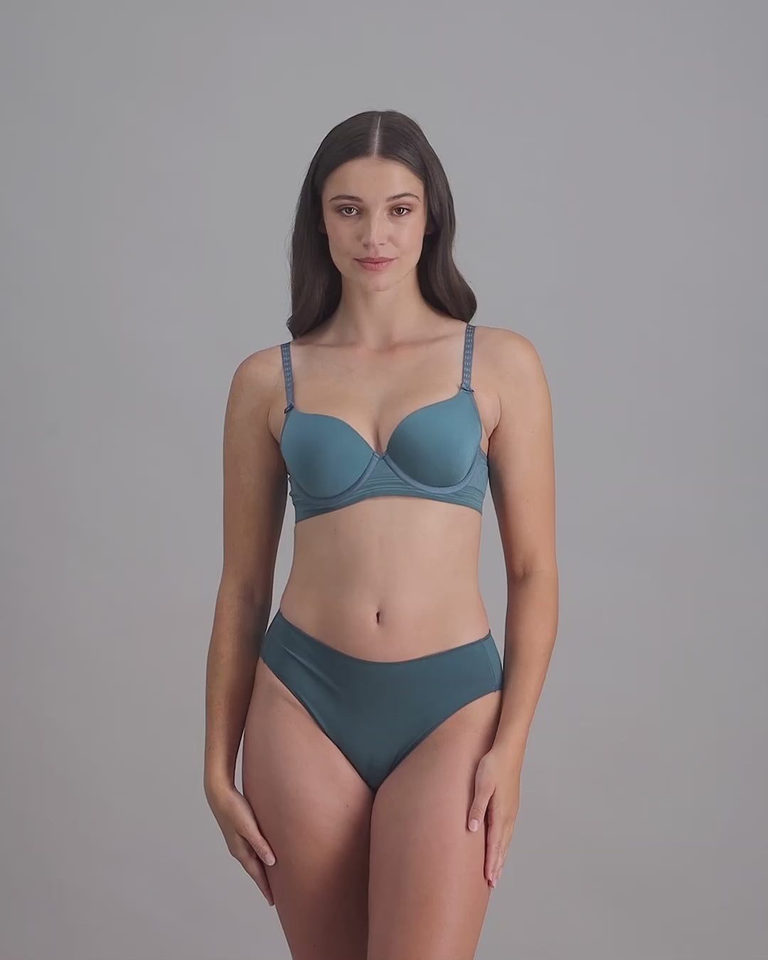 model-poses-in-blue-bra-and-underwear