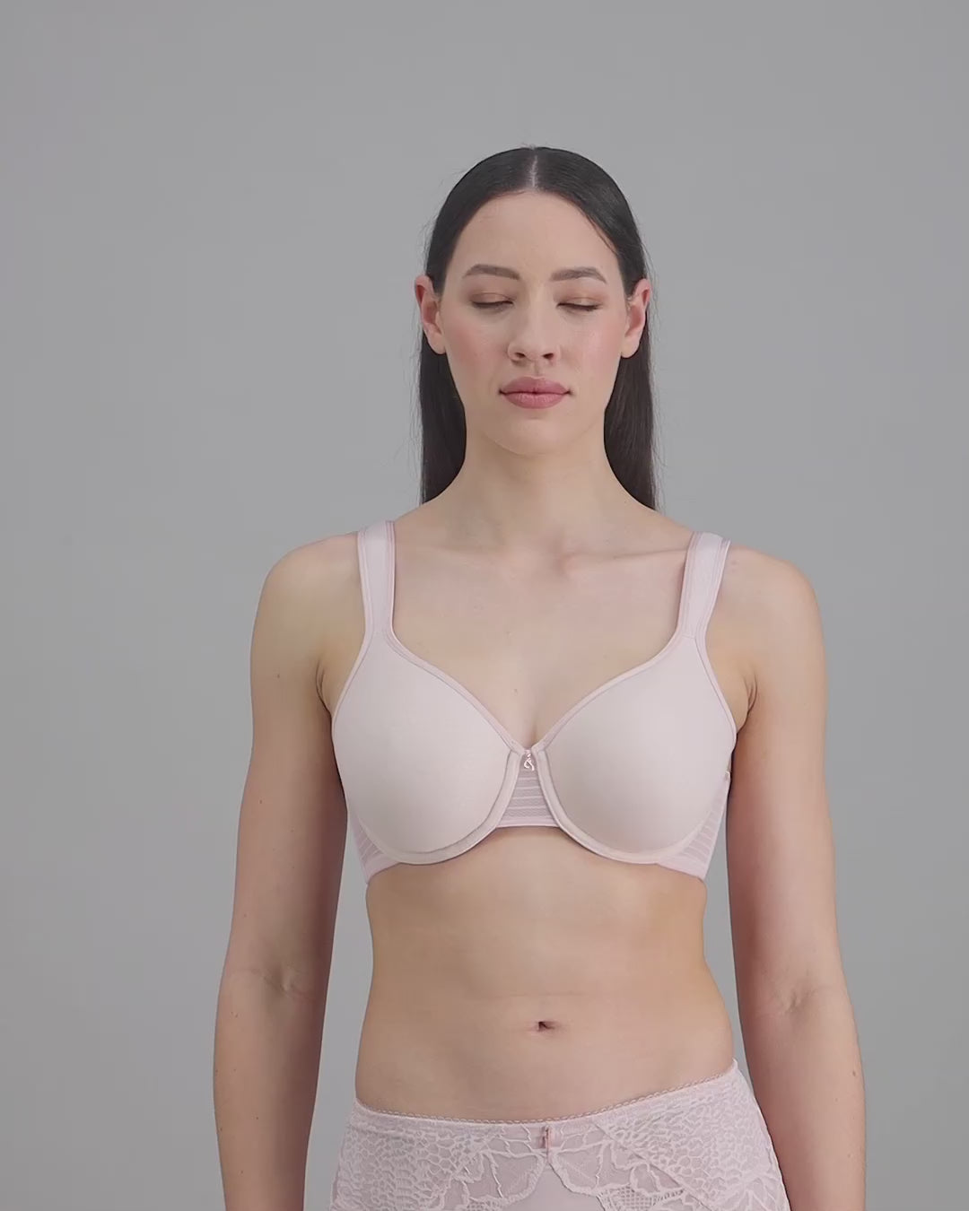 model-poses-in-pale-pink-bra-and-underwear