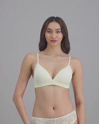 model-poses-in-light-yellow-bra-and-underwear