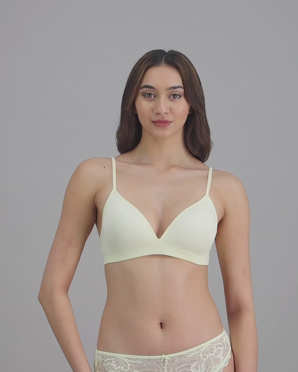 model-poses-in-light-yellow-bra-and-underwear