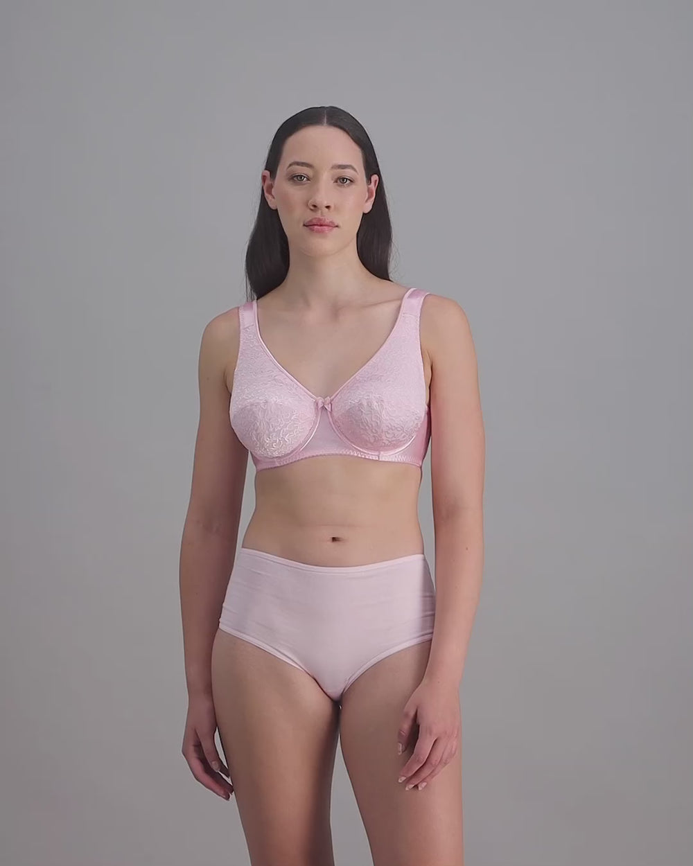 model-poses-in-light-pink-bra-and-underwear
